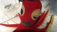 Whatjamacallit Wednesday: The Flirty Red Retro Octopus Check out Miss Flirty the octopus, a retro sawdust-stuffed red velveteen plush toy from someone’s past: Wearing nothing but a jaunty hat, a seed bead choker necklace, pouty lips and...